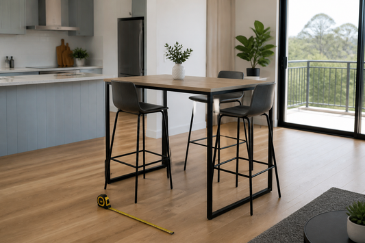 Bar-height table with stools and a tape measure in a bright Australian open-plan kitchen