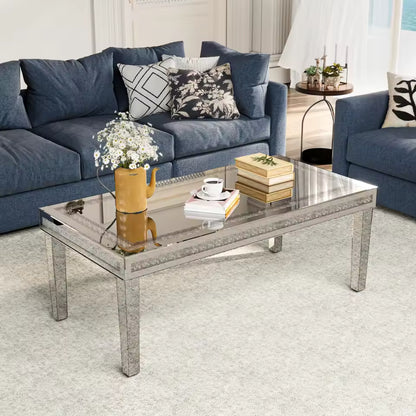 Rectangular mirrored coffee table with crystal crushed-diamond inlay in front of a blue couch.