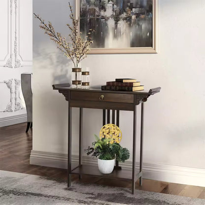 Antique wood console table with a drawer, styled with books, flowers, and a plant below.