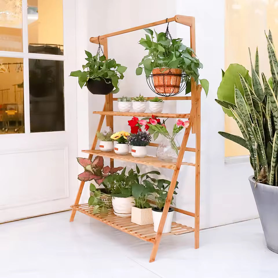 3-tier bamboo plant stand with hanging bar holding potted plants and flowers.