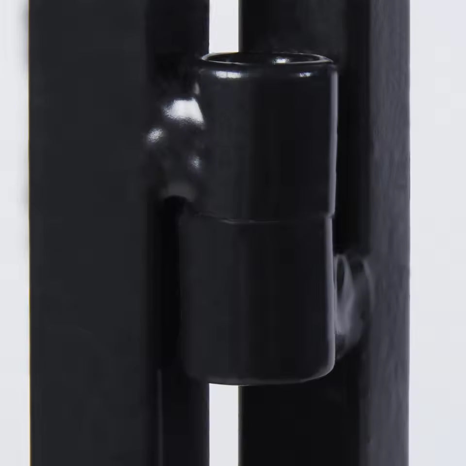 Close-up view of a black metal hinge joint mechanism on a frame structure.