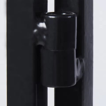 Close-up view of a black metal hinge joint mechanism on a frame structure.