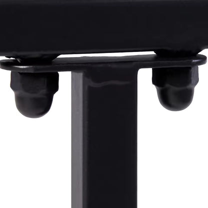 Close-up of a black metal frame joint secured with cap nuts and bolts.