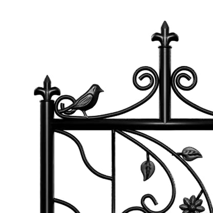 Black decorative metal garden trellis featuring a bird ornament, fleur-de-lis finials, and leaf accents.
