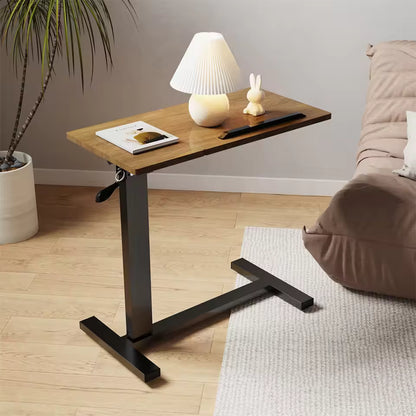 Height-adjustable C-shaped wood and metal side desk with a lamp, book, and decor item on top.
