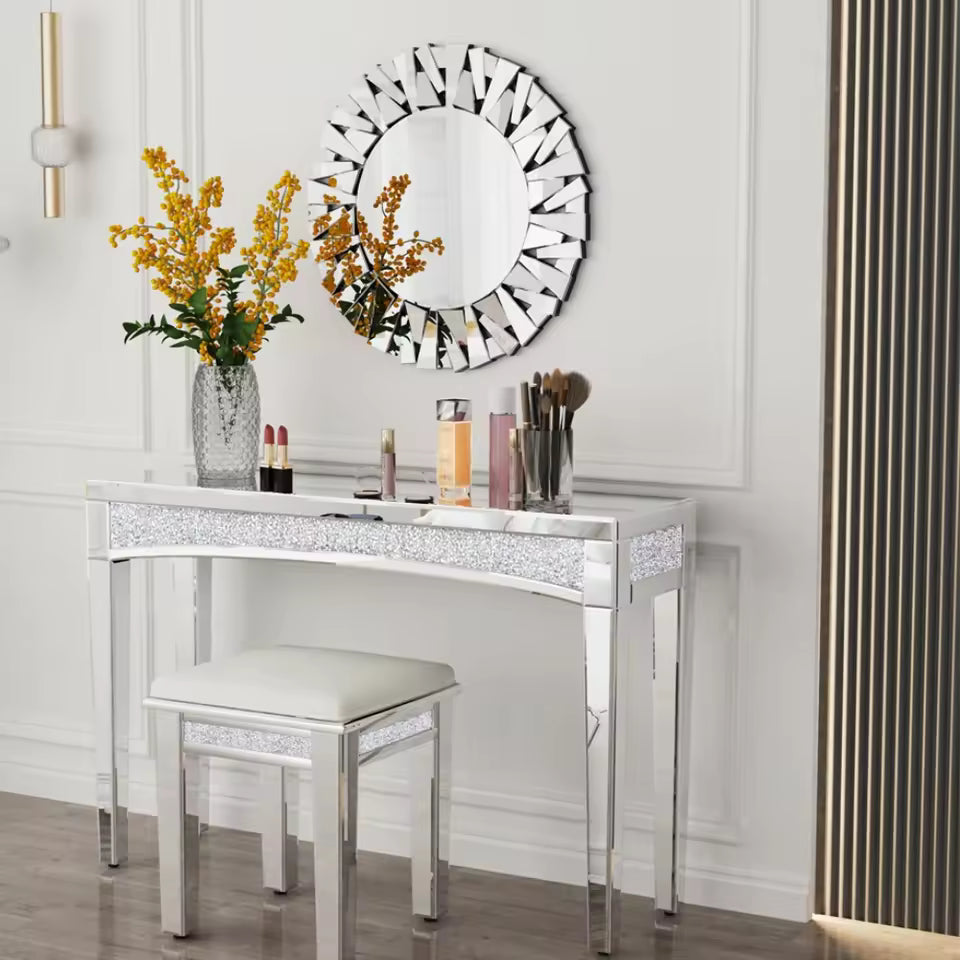 Silver mirrored vanity table set with crushed diamond accents, matching stool, and round mirror.
