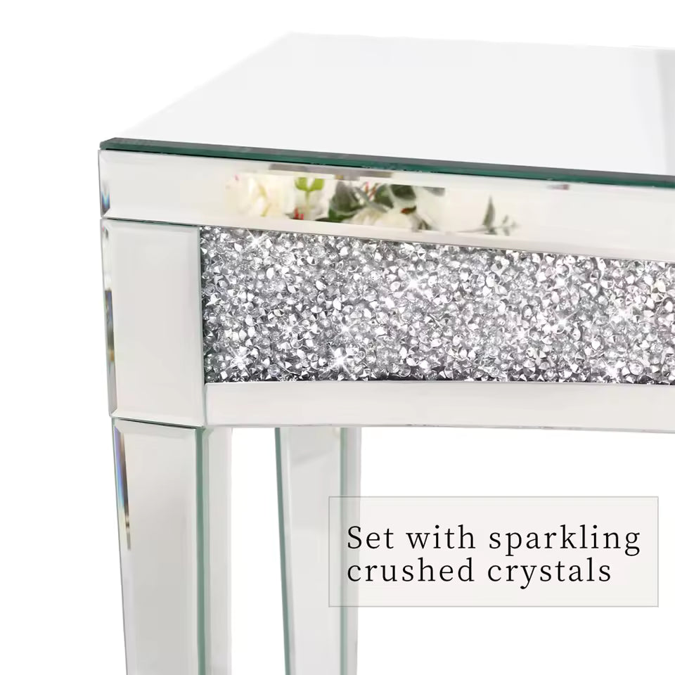 Close-up of a silver mirrored console table featuring a band of sparkling crushed diamond crystals.