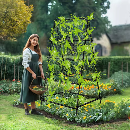 Woman holding a basket beside an A-frame garden trellis supporting climbing cucumber vines.