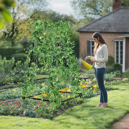 Woman watering a vine-covered metal A-frame garden trellis outdoors with a yellow can.