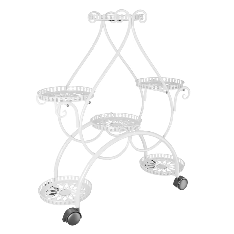 White multi-tiered metal plant stand with decorative scrollwork and rolling wheels.