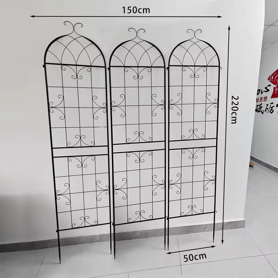 3-pack black metal arched garden trellis panels with measurements against a white wall.