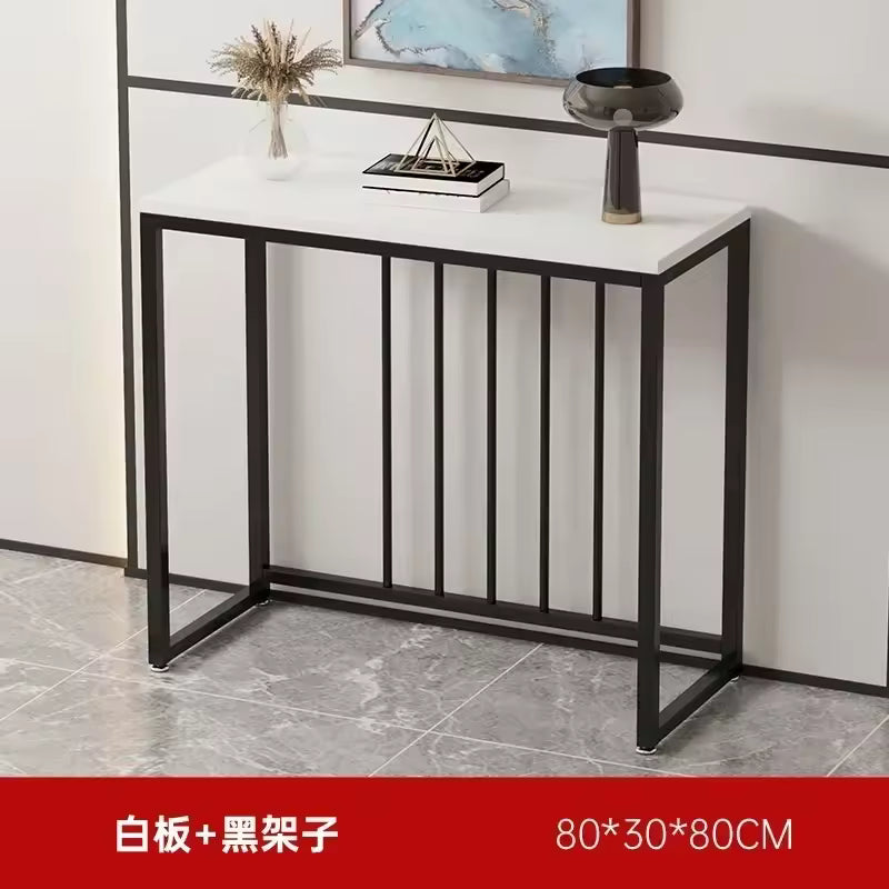Modern narrow console table featuring a white tabletop, black metal frame with vertical slatted accents.