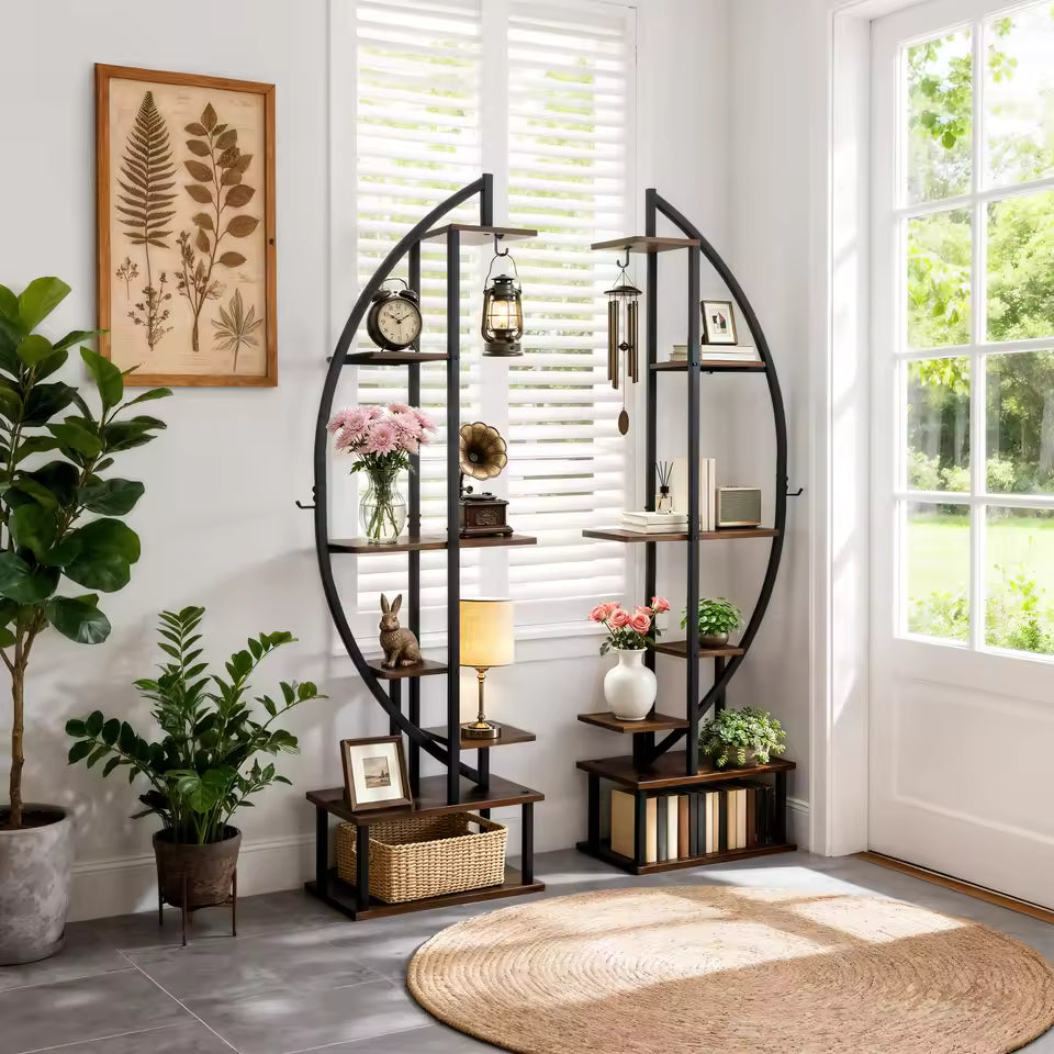 Two half-moon metal plant stands forming a curved display shelving unit in a bright living room.