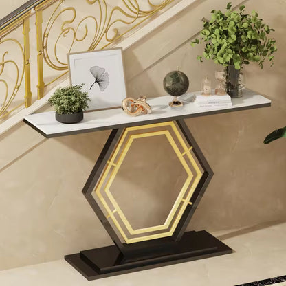 White sintered stone console table with a geometric hexagonal base, plants, and decorative objects.