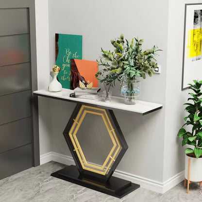 Modern narrow console table with a white top and geometric base, styled with artwork and foliage.