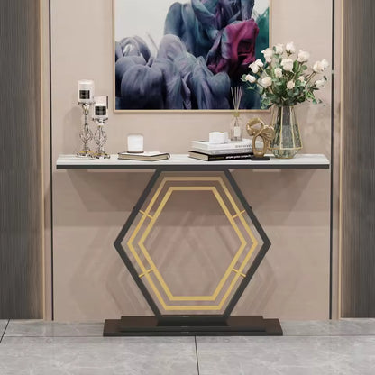 Modern console table with white stone top and geometric black and gold hexagonal base.